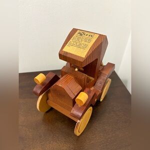 This is a vintage, handmade wooden toy golf cars.